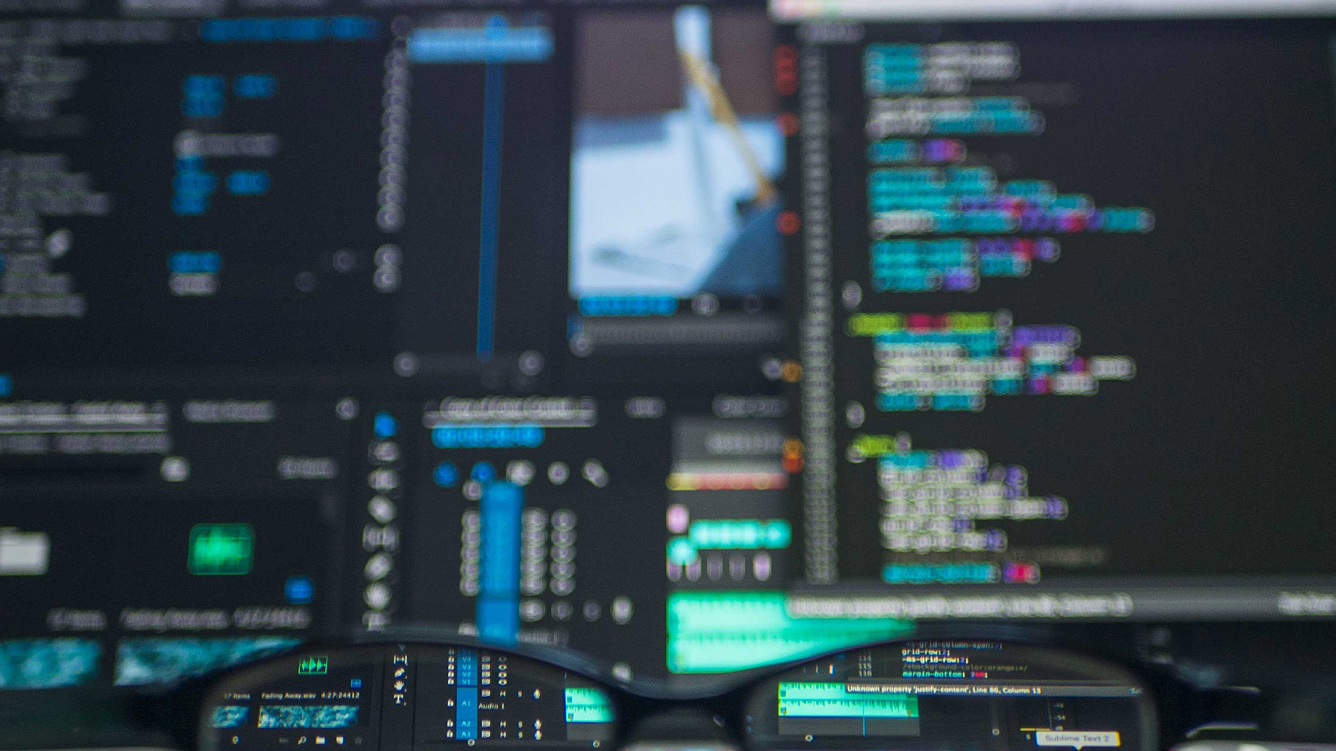 Developer screens reflected in glasses